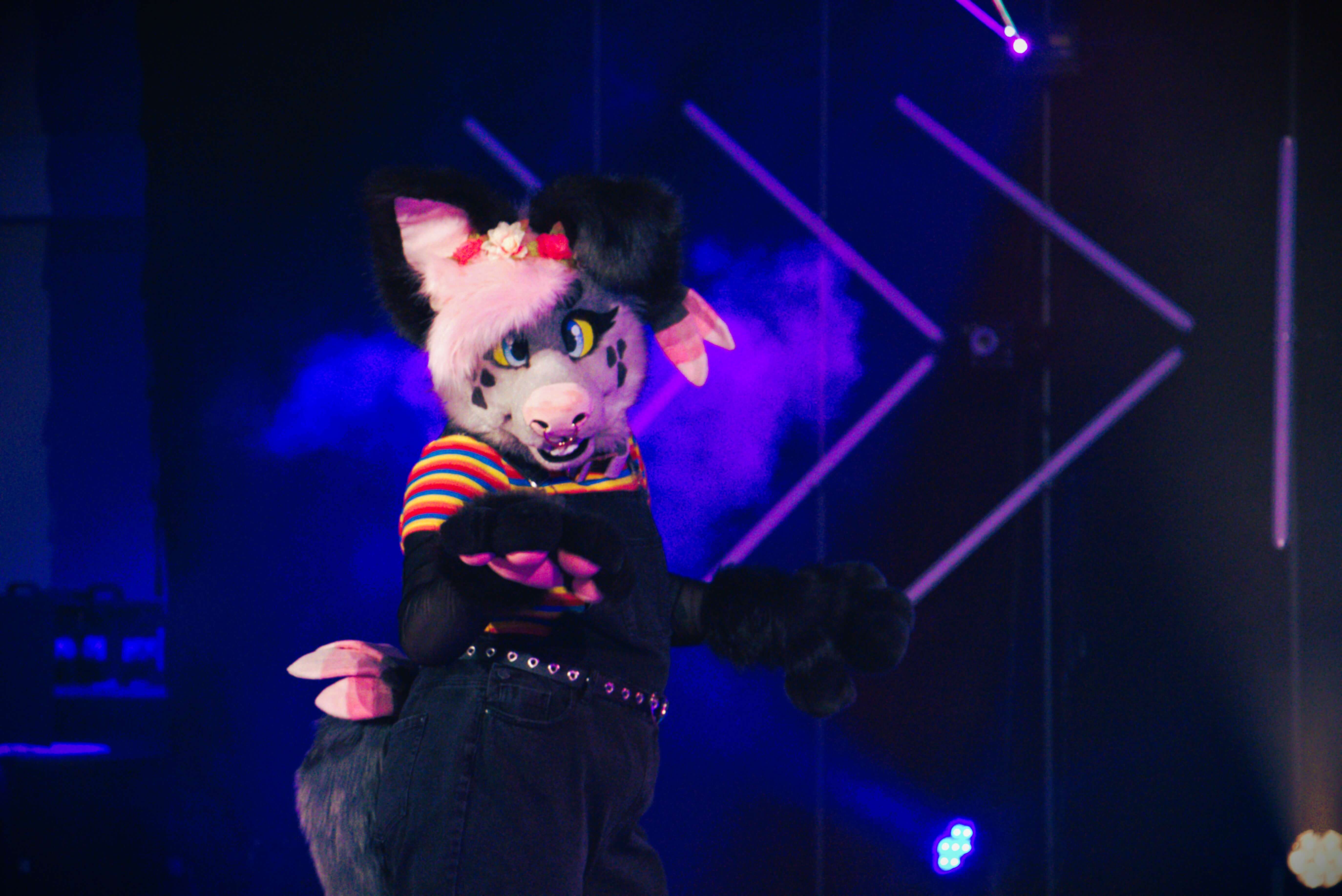 Fursuiter in the dance competition at ConFuzzled 2024